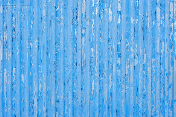 Blue corrugated metal fence.