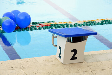starting place in the pool,starting place in the pool, outdoor swimming competition. athletes start on the starting podium. Sport is health and life. Well-being for the spirit
