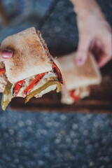 halved sandwich with cheese and meat