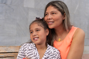 Mother And Daughter Relaxing In The Park
