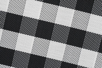 Black and white plastic table mat with checkered pattern