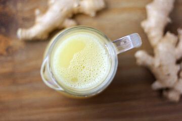 Obraz na płótnie Canvas Selective focus of glass jar with lemon ginger juice, organic, healthy, antioxidant and detox