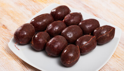 Spanish blood sausage morcilla on wooden table