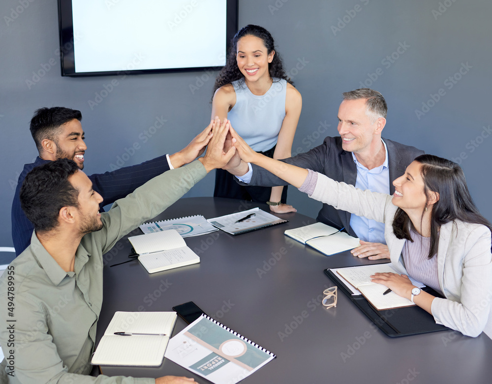 Sticker Were going to ace this project. Shot of a group of businesspeople giving each other a high five during a meeting in an office.