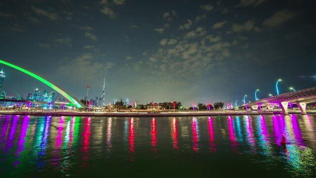 night light dubai canal reflection downtown crossing bridge panorama 4k time lapse uae