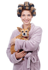 Fresh out the shower. Portrait of a happy young woman holding her dog while standing in a bathrobe.