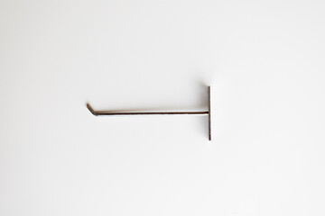 Wall stainless steel hook on isolated white background