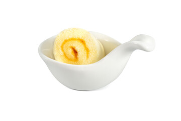 Orange roll cake on white spoon isolated on white background. Clipping path