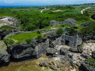 晴れた日の沖縄県糸満市にある観光スポットの具志川城址の空撮写真
