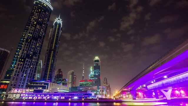 night light dubai famous hotel downtown canal bay panorama 4k time lapse uae