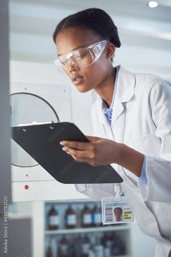 Poster drawing conclusions from her observations. shot of a young scientist working in a lab.