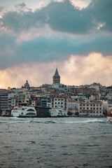 Fototapeta premium Panoramic photo of Galata Tower at sunset in Istanbul Turkey
