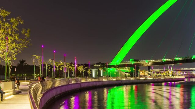 dubai water canal night light crossing bridge downtown panorama 4k time lapse uae