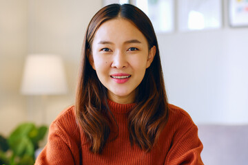 Portrait of young Asian woman smile and look at camera