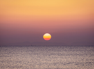 Sunrise on the beach with calm sea