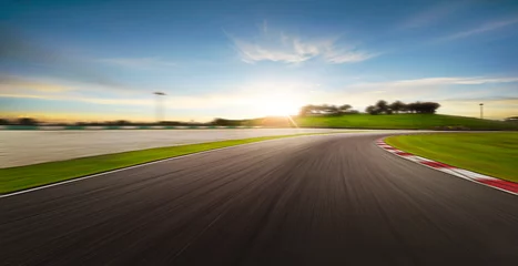 Foto op Plexiglas Sunset motion blurred race track. © Image Craft