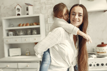 People spend time at home in a kitchen