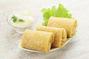 Stuffed pancakes with meat and cream