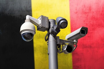 Closed circuit camera Multi-angle CCTV system against the background of the national flag of Belgium.