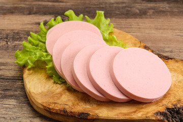 Sliced sausage snak over board