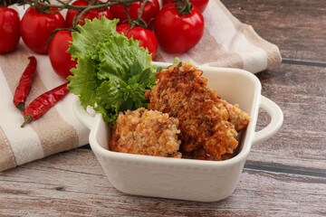 Fried salmonn cutlet in the bowl
