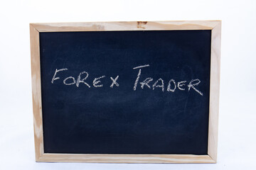 The term FOREX TRADER displayed on a chalkboard