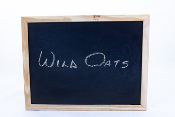 The term WILD OATS displayed on a blackboard