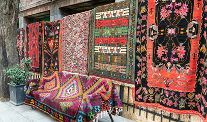 handmade carpets are sold on the street. street trade