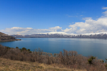 Fototapeta premium View of Lake Sevan and the snow-capped peaks around it in Armenia.