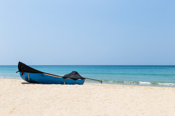 Fototapeta na wymiar Wooden boat on the beach, travel to asia, tropical island, empty clean beach in summer seson