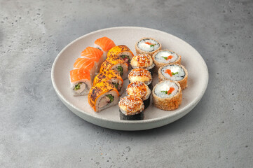 sushi set with maki rolls on gray background