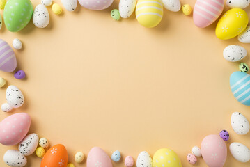 Top view of a lot of multicolored pastel and white middle and small eggs situated on isolated beige background with copyspace in the middle