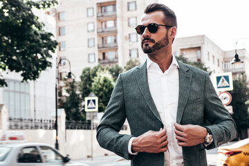 Portrait of handsome confident stylish hipster lambersexual model.Sexy modern man dressed in...