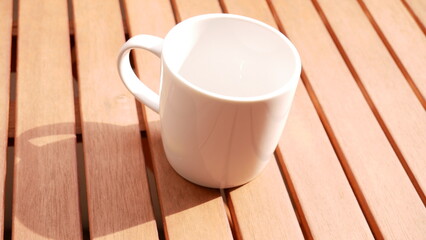 White coffee cup on a wood table