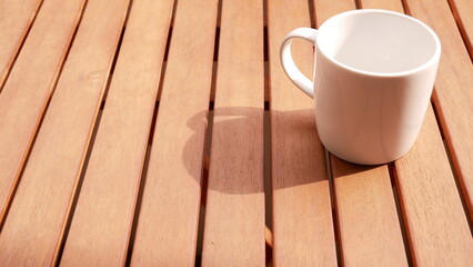White coffee cup on a wood table