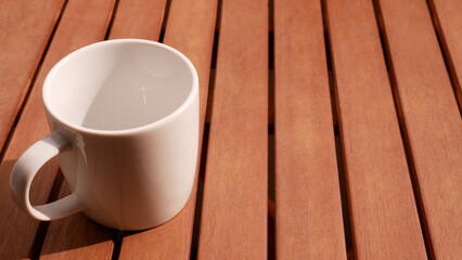 White coffee cup on a wood table