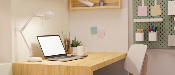 Minimal and comfortable home workspace with portable laptop mockup