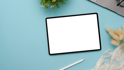 Graphic tablet touchpad white screen mockup on pastel blue background.