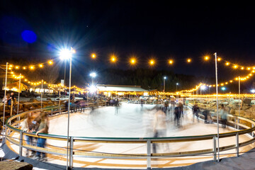 beautiful outdoor ice rink at night with lights