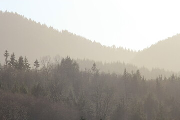 Mountains silhouette in complex orange gradations in the morning.