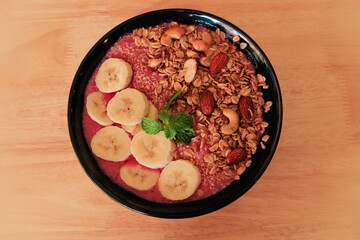Healthy vegan smoothie bowl for breakfast following the current diet fads and food trends of a more sustainable living
