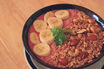Healthy vegan smoothie bowl for breakfast following the current diet fads and food trends of a more sustainable living