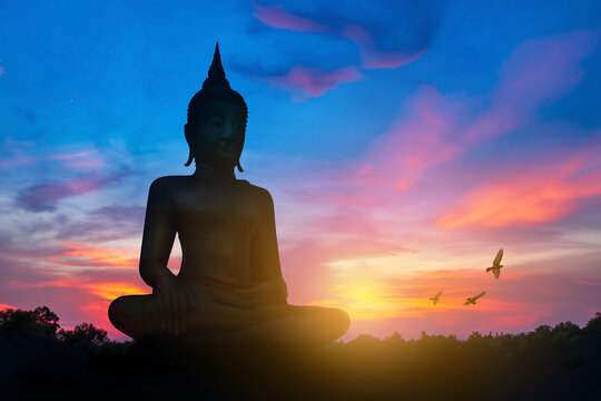 Big Buddha, meditating Buddha statue. Buddha images belief in Buddhism on sunset sky