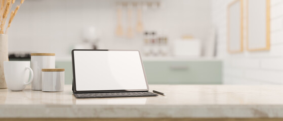 Tablet touchpad mockup and copy space on white marble kitchen countertop