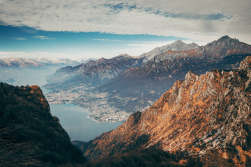 sunset in the mountains over lake como in italy - obrazy, fototapety, plakaty