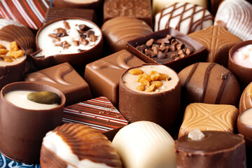 Various chocolate praline candies assortment close up