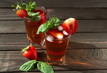 fresh ripe strawberries on a dark wooden background