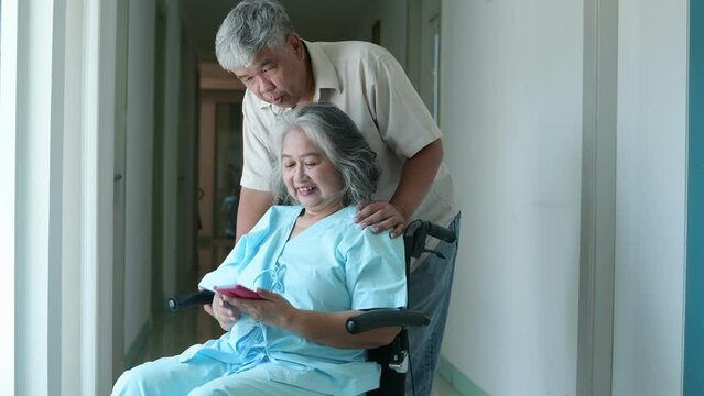 Asian man visiting wife in hospital, Senior couple making video call on mobile phone with their grandchildren, support and take care, Healthcare and Medical