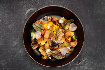 Vegetable stew with mushrooms in a pan