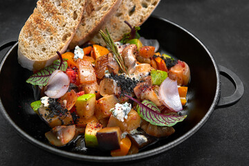 Vegetable stew with mushrooms in a pan